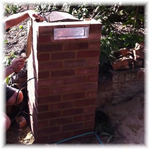 Stamford mailbox built into a brick pier